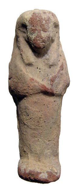 Late Period Egypt, terracotta ushabti: A terracotta ushabti, Late Period, c. 664 - 30 BC, mummiform, wearing tripartite headdress, arms crossed over chest, hands holding implements. L: 3 7/8" (9.8 cm). Intact with remains of dressing. Ex D