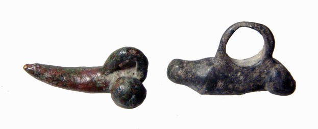 2 Roman bronze phallic amulets: A pair of Roman bronze phallic amulets, c. 1st - 3rd Century AD, the first with widely spaced balls and a small suspension loop, L: 1 1/4" (3.2 cm). The second with compact balls, the separation