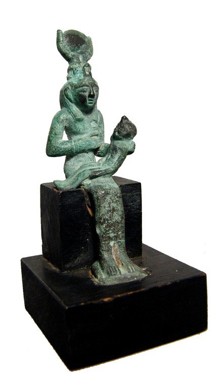 Egyptian beautiful bronze figure of Isis: A beautiful bronze figure of the goddess Isis, Saite, Dynasty 26, c. 664 - 525 BC, seated wearing a long gown, sucking the infant Horus who sits in her lap. Atop her head is a headdress consisting of 