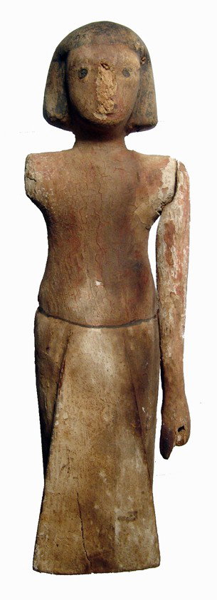Middle Kingdom wooden figure, Egypt: A Middle Kingdom wooden figure, c. 1980 - 1630 BC, wearing short wig and triangular apron. The body is nicely carved and much of the original paint remains. H: 8" (20.3 cm). Some overall wear and miss