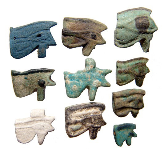 Group of 10 faience 'Eye of Horus' amulets: A group of 10 faience 'Eye of Horus' amulets. Lot includes examples from the 3rd Intermediate Period, c. 1075 - 945 BC and from the Late Period, c. 664 - 30 BC. Seven of the amulets are bi-color and o