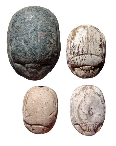 Nice lot of 4 Egyptian scarabs: A nice lot of 4 Egyptian scarabs. The lot includes an early New Kingdom steatite scarab with a 'Ptah is truth' on base, 15 x 10mm; a 2nd Intermediate black steatite scarab with scroll pattern between 