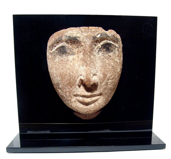 Pleasing Egyptian wooden 'mummy' mask: A pleasing Egyptian wooden 'mummy' mask, 3rd Intermediate Period, c. 1075 - 664 BC, with handsome features and remains of paint on the eyes and brow. H: 5 1/2" (13.9 cm). Traces of white dressing, lig
