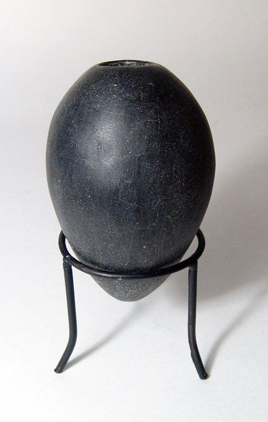 Predynastic black-ware cosmetic jar, Naqada II: A choice Predynastic black-ware cosmetic jar, Naqada II, c. 3650 - 3300 BC, perfectly crafted to fit comfortably in the hand. The body ovoid with a near pointed base and the shoulders quite steep with