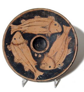 Campanian red-figure fish plate, Magnia Graecia: A lovely Campanian red-figure fish plate, Magnia Graecia, c. 340 - 320 BC, with ring base, the top of the plate slightly concave, the lip folded downward, a small depression at center. The top of the