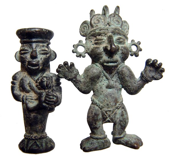 Pair of Tolima copper pendant, Colombia: A pair of Tolima copper pendant, Colombia, c. AD 1000 - 1500, one wears an elaborate headdress, jewelry and a lion cloth, hand open and raised. The second figure suckles a child she holds in her arms,