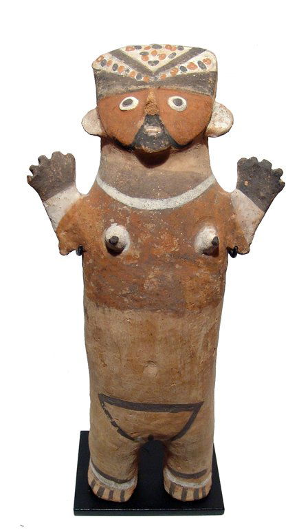 Very large Chancay ceramic female figure, Peru: A very large Chancay ceramic female figure, Peru, c. AD 1000 - 1450, depicted nude, wearing a tall decorated headdress, hands held skyward. The figure wears a simple necklace and anklets, the tiny bre