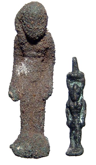 2 bronze Egyptian amulets, Ex Negus collection: A lot of 2 bronze Egyptian amulets, Late Period, c. 664 - 30 BC, the first of Harpokrates, 48mm, and the second of Nefertum, H: 20mm. Both intact, the first with thick patination, the Nefertum quite n