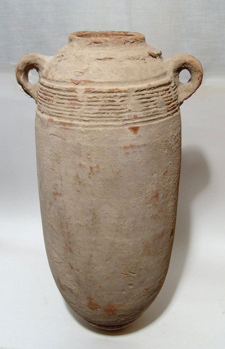 Large Phoenician transport amphora: A large Phoenician transport amphora, c. 5th - 3rd Century BC, with long body and rounded base, the shoulders tapering to the mouth, no neck, the rim vertical without lip, round handles to either side
