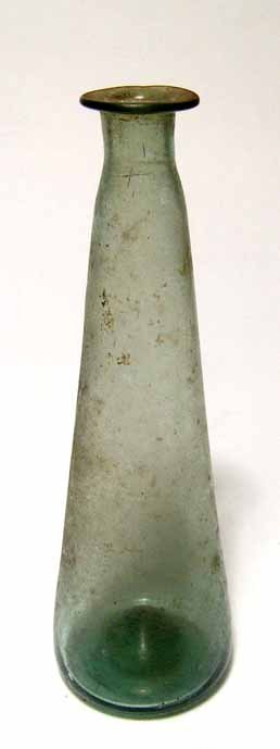 Olive green Roman glass bottle: An olive green Roman glass bottle, c. 4th - 5th Century AD, with wide bottom with indented base, sides narrowing to a lightly flared mouth. Intact. H: 5 3/4" (14.8 cm). Ex Henk Huffener collection, UK