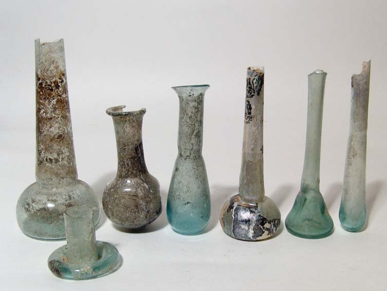 Lot of 6 Roman glass bottles: A lot of 6 Roman glass bottles, c. 1st - 2nd Century AD, each with minor losses and a few with attractive iridescence. Sizes from 3 1/2" (8.9 cm) to 5 1/2" (13.9 cm). Ex Los Angeles private collection