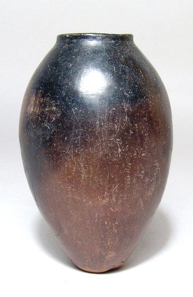 Predynastic black-top jar, Naqada II: An attractive Predynastic black-top jar, Naqada II, c. 3650 - 3300 BC, well-crafted and fits comfortably in the hand. The body ovoid with a narrow flattened base, the shoulders quite steep and the mou
