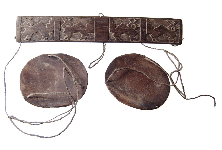 Well-preserved Chancay wooden scale, Peru: A well-preserved Chancay wooden scale, Peru, c. AD 1100 - 1450, the beam nicely carved with four animals within recessed rectangles. A good example and re-strung with cord from the same period. Beam 5