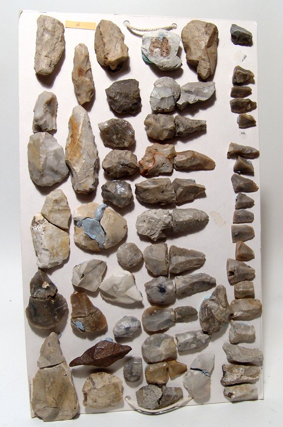 Lot of 45 European stone age tools: A lot of 45 European stone age tools, all mounted on a rectangular piece of card board via removable putty. Largest measures 2 3/8" (6.2 cm) in length. Ex European private collection.