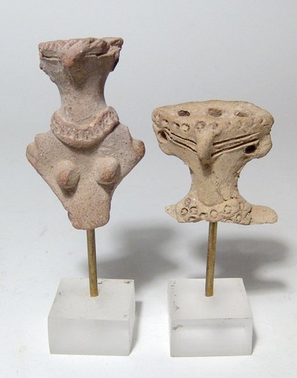 2 Busts from Egyptian terracotta fertility 'dolls': A pair of busts from Egyptian terracotta fertility 'dolls,' Late Middle Kingdom - 2nd Intermediate Period, c. 1759 - 1570 BC, each with bird-like features and holes in the head for the attachment of h