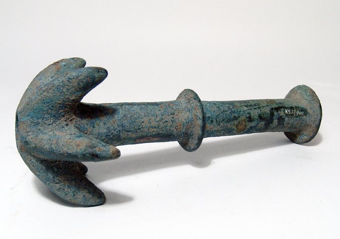 Near Eastern spiked bronze mace head: A Near Eastern spiked bronze mace head, c. 1200 - 800 BC, composed of a tubular shaft surmounted by a head with six spikes, each curving backwards with curved upper surfaces. At the center and base of