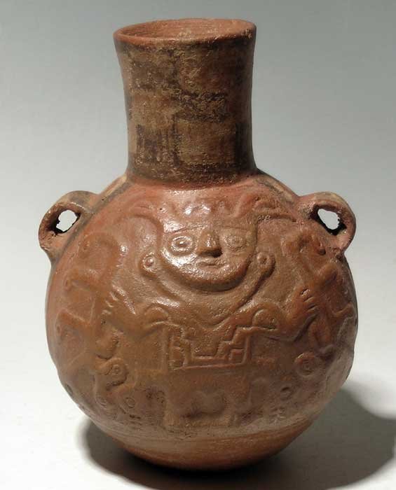 Fine Huari bottle from Peru, c. 650 - 800 AD: A fine Huari bottle from Peru, c. 650 - 800 AD. This finely detailed vessel is 6-3/4" high and features two representations of a Harvest Deity. He is molded in high relief and is depicted holding larg