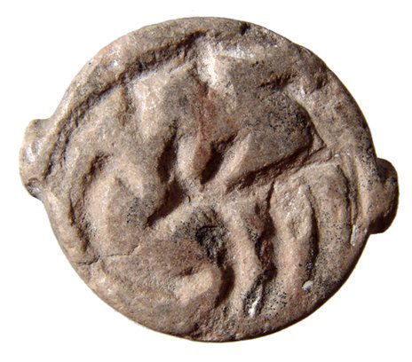 Uruk/Jemdet Nasr hemispheroid stamp seal: An Uruk/Jemdet Nasr hemispheroid stamp seal, c. 3300 - 2900 BC, of cream colored stone, the base carved with a mouflon and animal, pierced lengthwise for suspension. L: 1 1/4" (3 cm). Ex Prof. Hans Er