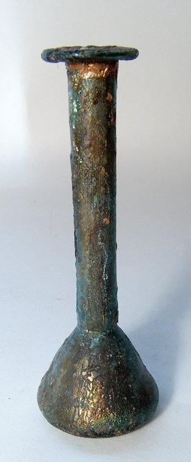 Roman green glass candlestick unguentarium: A Roman green glass candlestick unguentarium, c. 2nd - 3rd Century AD, the body bell-shaped with indented base and pontil mark, the neck long and tubular with light constriction above shoulder, the ri