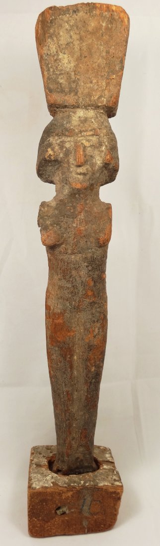 Egyptian wooden bearer statuette: An Egyptian wooden bearer statuette carrying the offering basket on her head, c. Ptolemaic period, H: 28.8 cm. Missing both arms and chipping of the wood, but mostly intact. Ex New York private collec