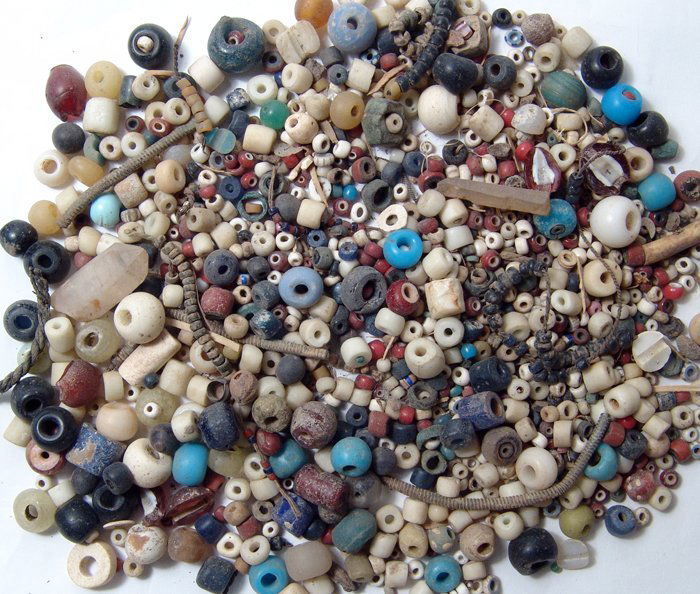 A Large Lot of Antique Beads: A large lot of mixed European and Near Eastern Antique Beads, mostly glass, some quite old, and many still strung on fragments of old necklaces. Ex English Private Collection.