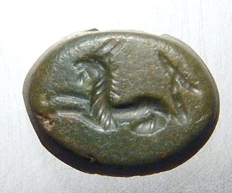 Green jasper intaglio with a Capricorn: A nice Roman green jasper intaglio with a Capricorn, c. 1st Century AD, the birth sign of the emperor Augustus and was often set in rings of his supporters, nicely rendered with curled tail. 12 x 9mm.