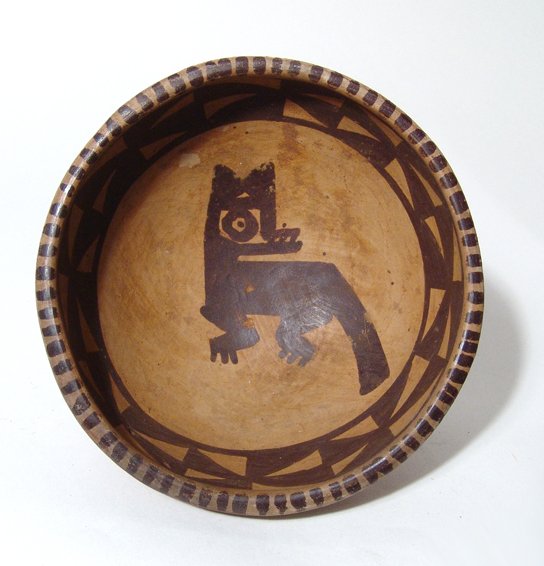 A Narino Tuza pedestal Bowl with a feline: A Narino Tuza pedestal Bowl with a feline, Tuza cultural complex of Colombia, c. AD 1250 - 1500, the interior nicely painted, the feline with long tail and head turned back over its body, the rim ador