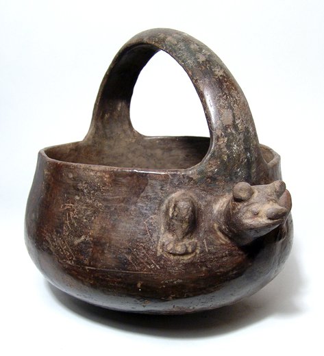 Tairona Bat Effigy Vessel With Basket Loop Handle: A Tairona bat effigy vessel, Colombia, c. AD 800 - 1000, nicely burnished deep brown surfaces, the bowl large and rounded at the bottom with a large basket loop handle. To either side of the vessel, j
