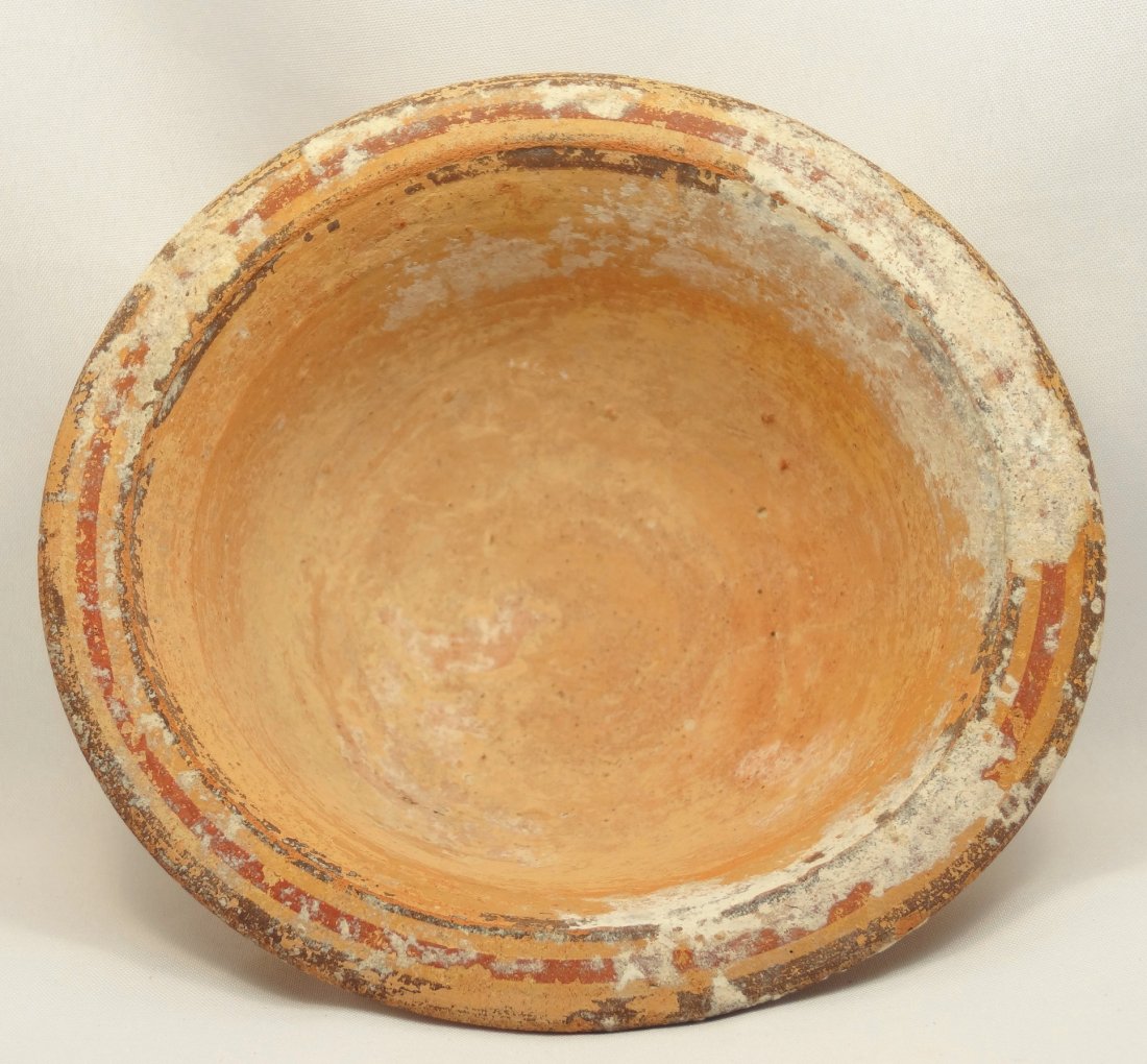 Cypriot Iron Age, 1050-475 BC, bichrome bowl: A Cypriot Iron Age, 1050-475 BC, bichrome bowl with an out-turned rim and decorated with bands of red and brown slip circling the rim. H: 1 3/4Ó (4.4 cm), D: 4 3/10Ó (11 cm). Ex London Collection Fo