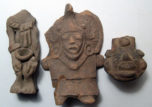 A lot of 3 Pre-Colombian terracottas: A lot of 3 Pre-Colombian terracottas. Lot includes a molded figure wearing an elaborate headdress, H: 4 1/2" (11.5 cm); a partial terracotta seated figure with bowl sitting on his knees, H: 4" (10.1 c
