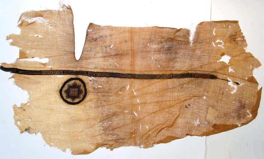 A large fragment of a Coptic tunic: A large fragment of a Coptic tunic with decorative embroidery, Egypt, c.4th Century AD, linen and wool, the ÒV-neck" visible from the front of the garment. The decoration includes a narrow embroidere