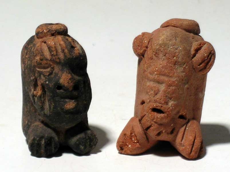 A pair of Vera Cruz deity whistles: A pair of Vera Cruz deity whistles from Mexico, c. 300 - 900 AD. They are 1-5/8" high and depict feline deities. One with extensive chapopote and great tone. Ex C.W. Slagle estate.