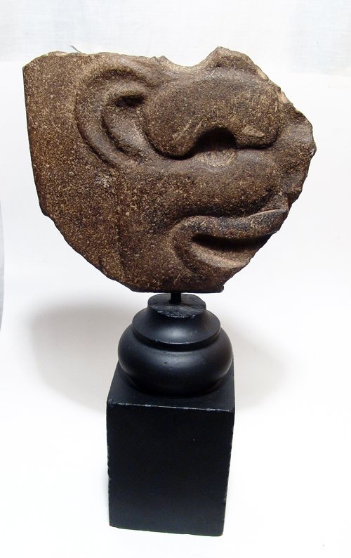 Fragment of a Vera Cruz basalt Hatcha: A fragment of a Vera Cruz basalt Hatcha, AD 700 - 900, with a feline head seen in profile, mouth agape. The piece is nicely mounted on a tall base. 7 in x 8 in (17.8 x 20.3 cm). Ex Midwest collection.