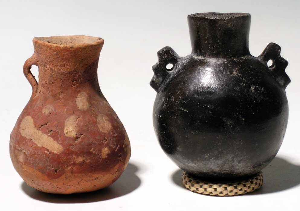A pair of fine Inca vessels from Peru,c. 1300 – 1500 AD: A pair of fine Inca vessels from Peru, c. 1300 – 1500 AD. The painted pitcher is 2-3/4” high and has a delicate loop handle that remains intact. The blackware bottle is 3” high and has a pai