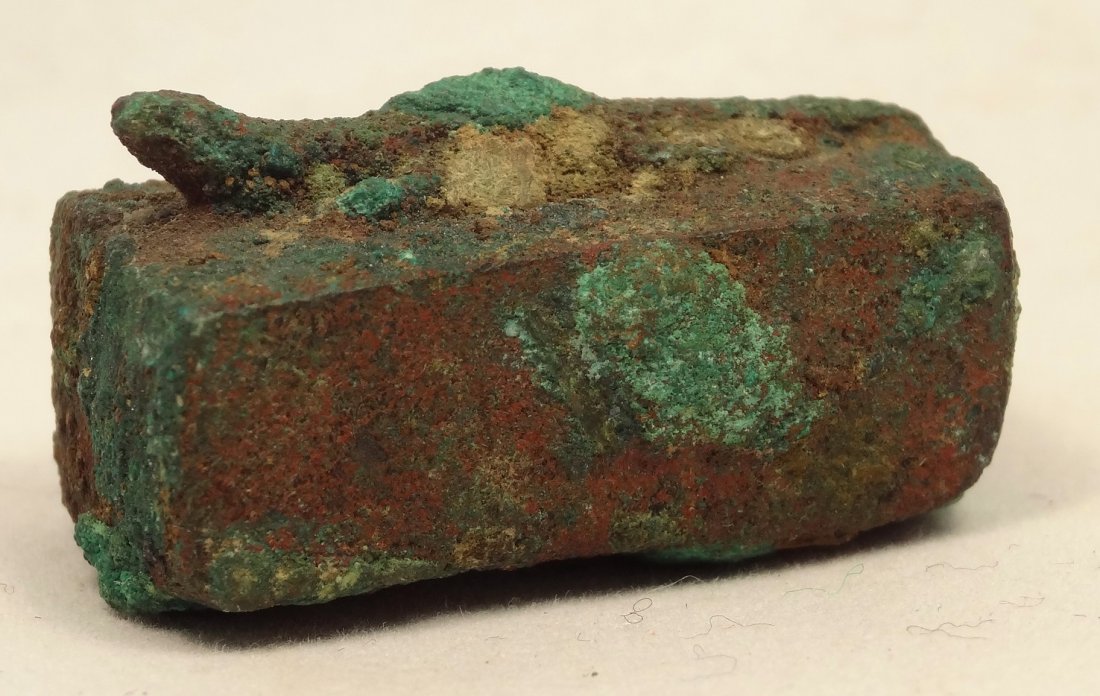 Ancient Egyptian lizard sarcophagus exLord Kitchener: A bronze lizard sarcophagus, Late Period, c. 664-30 BC, H: 3/5 in (1.6cm), L: 1 1/8 in (2.8cm), of rectangular form. On top, an resting lizard with a long tail. Intact with heavy deposits and encrusta