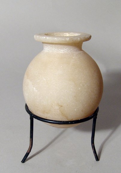 Egyptian alabaster round-bodied jar, Ex Lord Kitchener: A choice Egyptian alabaster round-bodied jar, Middle Kingdom, 11th - 12th Dynasty, c.2134 - 1802 BC, very well carved with thin walls and completely translucent. H: 3 1/2" (8.9 cm). Intact with age pa