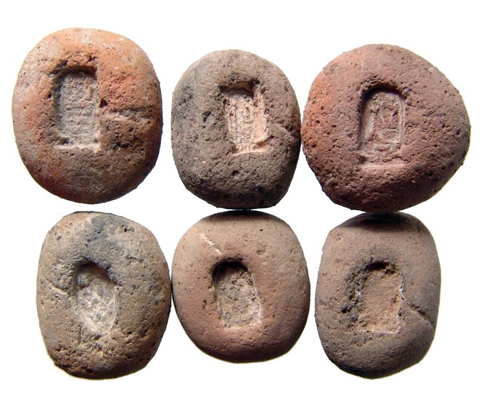 A lot of 6 Egyptian terracotta molds: A lot of 6 Egyptian terracotta molds, Late New Kingdom, c. 1292 - 1075 BC, five for an amulet with a royal cartouche. Four of them have been cleaned or partially and are for Ramesses II, the other unc