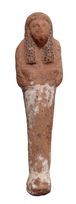 Egyptian terracotta ushabti, New Kingdom: An Egyptian terracotta ushabti, New Kingdom, c. 1570 - 1075 BC, mummiform, wearing tripartite wig with curled locks, arms folded across chest, hands holding implements. H: 7" (17.8 cm). Intact, traces