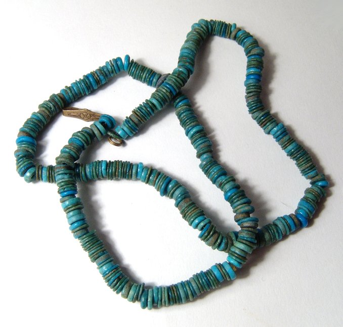 Necklace composed of choice Egyptian faience disc beads: A necklace composed of choice Egyptian faience disc beads, 3rd Intermediate to Late Period, c. 1075 - 332 BC, the beads wide and flat with excellent color, much rarer that the standard disc beads usua