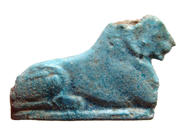 Egyptian inlay of recumbent lion, Ex Lord Kitchener: An Egyptian faience inlay of a recumbent lion, Graeco-Roman, c. 2nd Century BC - 2nd Century AD, in good style with well-preserved glaze. L: 9 cm. Some minor edge losses. Ex collection of Field Marsha