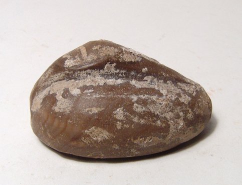 Mesopotamian duck weight and a pair of Byzantine: A Mesopotamian duck weight and a pair of Byzantine weights. The Mesopotamian quartzite duck weight, c. Late 2nd -Early 1st Millennium BC, the body oval with flat bottom, the long neck turned back, the