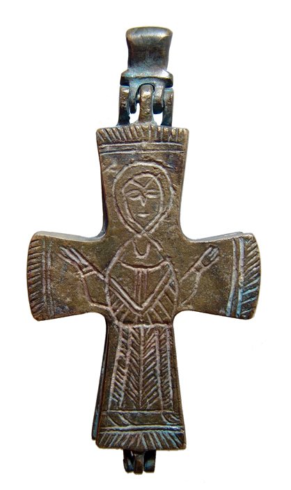 A bronze Byzantine-style reliquary cross: A bronze Byzantine-style reliquary cross, c. 8th - 10th Century AD, comprised to two halves joined with hinges at top and bottom and a heavy loop for suspension. The front side in incised with the ima