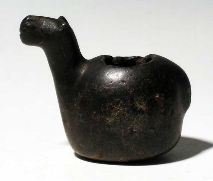 A choice Inca canopa from Peru: A choice Inca canopa from Peru, c. 1300 - 1500 AD. This beautiful example is 3-1/4" long, is carved from a nicely polished black stone and depicts a llama. The head is beautifully detailed and the cav