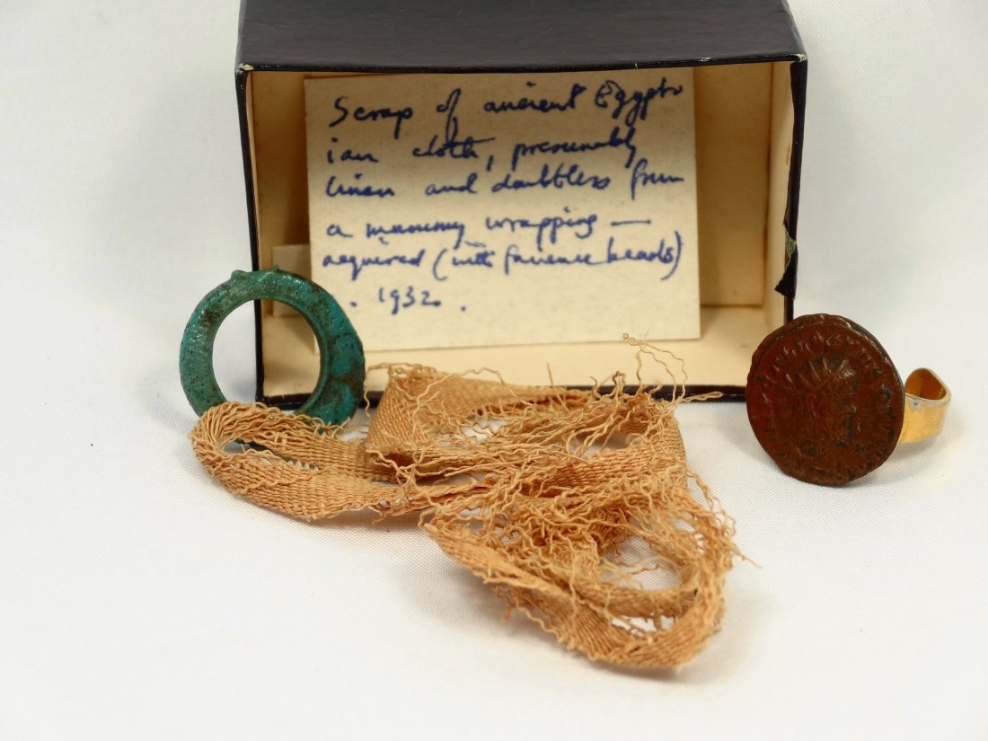 A lot of 3 Egyptian and Roman items: A lot of 3 Egyptian and Roman items. The first, a strand of linen mummy wrappings, L: 9 2/5 in (24cm). The second is a glazed turquoise faience ring, D: 3/4 in (2cm). The third piece is a 3rd Century
