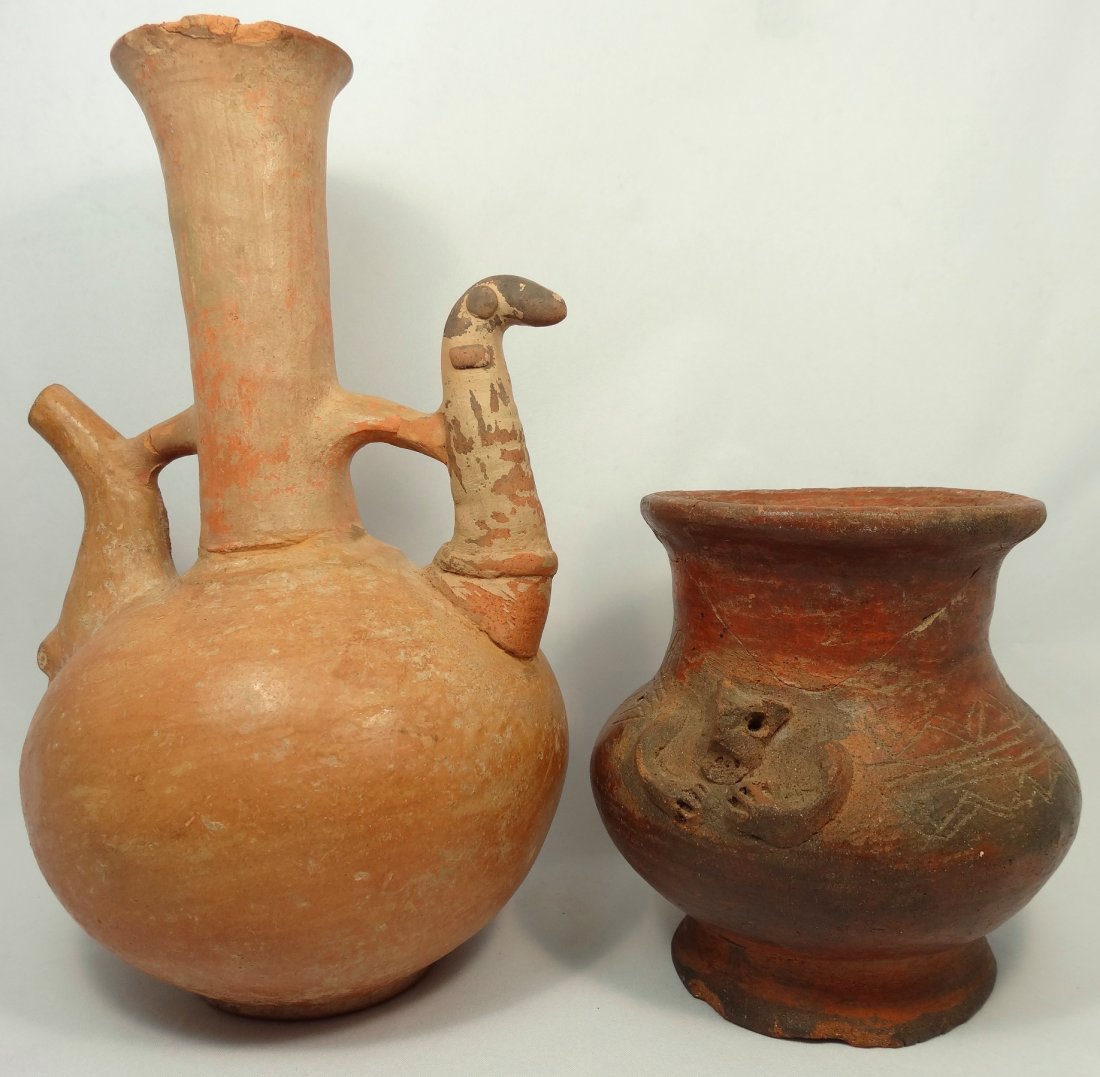 2 ancient, burnished orange-ware vessels: A lot of 2 ancient, burnished orange-ware vessels. The first a burnished orange-ware spouted vessel, Central Asia, c. 1st Millennium BC, the rounded body with disk base, the tall, flared neck at cente