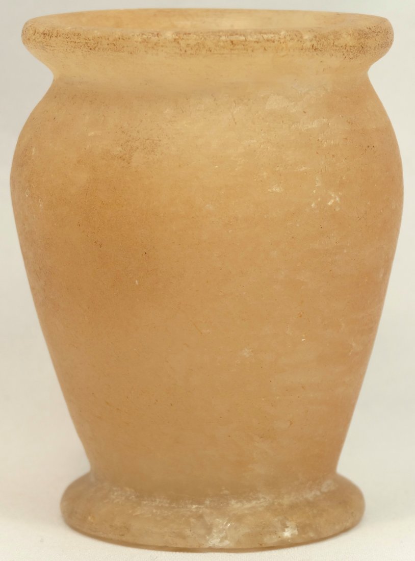 An Egyptian alabaster footed vessel: An Egyptian alabaster footed vessel, Middle Kingdom, c. 2055-1650 BC. The rim flares slightly outward, H: 2 3/4 in (7cm). Ex collection of a well known, titled English family acquired in the early 190