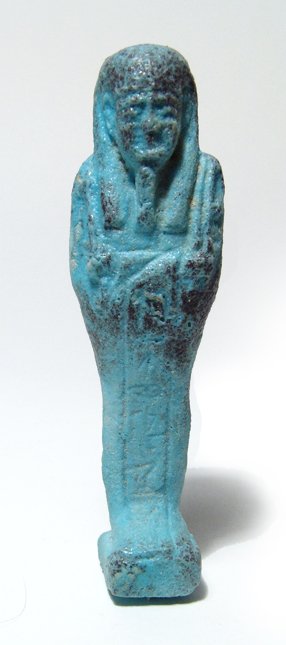 Egyptian blue-green faience ushabti: An Egyptian blue-green faience ushabti, Late Period, c. 664 - 332 BC, mummiform, wearing tripartite wig and false beard, arms folded across chest, hands holding a pick and hoe, bag over left shoulder,