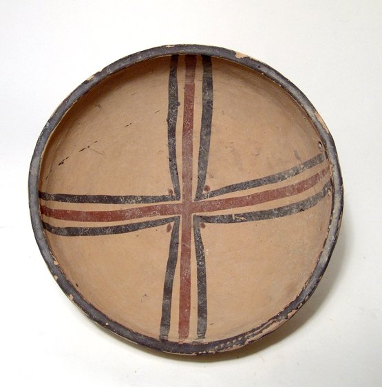 Daunian Sub-Geometric II ceramic bowl: A nice Daunian Sub-Geometric II ceramic bowl, Italic, c. 550 - 450 BC, with a cruciform device on the interior in brown and red over a creme slip, curving lines around the outside of the rim. Dia: 7 1