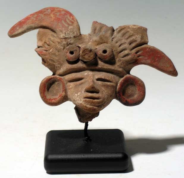 Exceptional Teotihuacan head fragment from Mexico: An exceptional Teotihuacan head fragment from Mexico, c. AD 200 – 650. This rare Tlamimilopa-Xolalpan type is 4-1/4” wide and depicts an individual wearing a complex feather-studded headdress and 