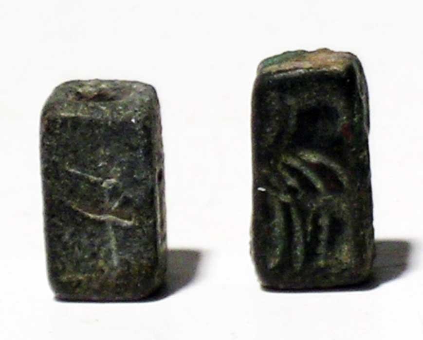 Pair of Mesopotamian stone seals: A pair of Mesopotamian stone seals, c. 3rd – 2nd millennium BC. These two rectangular stone bead seals having simple carved abstract designs on seal faces and are perforated lengthwise. Intact. Ex F
